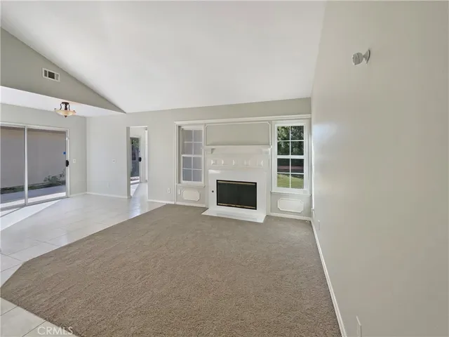 wooden floor and fireplace in empty room