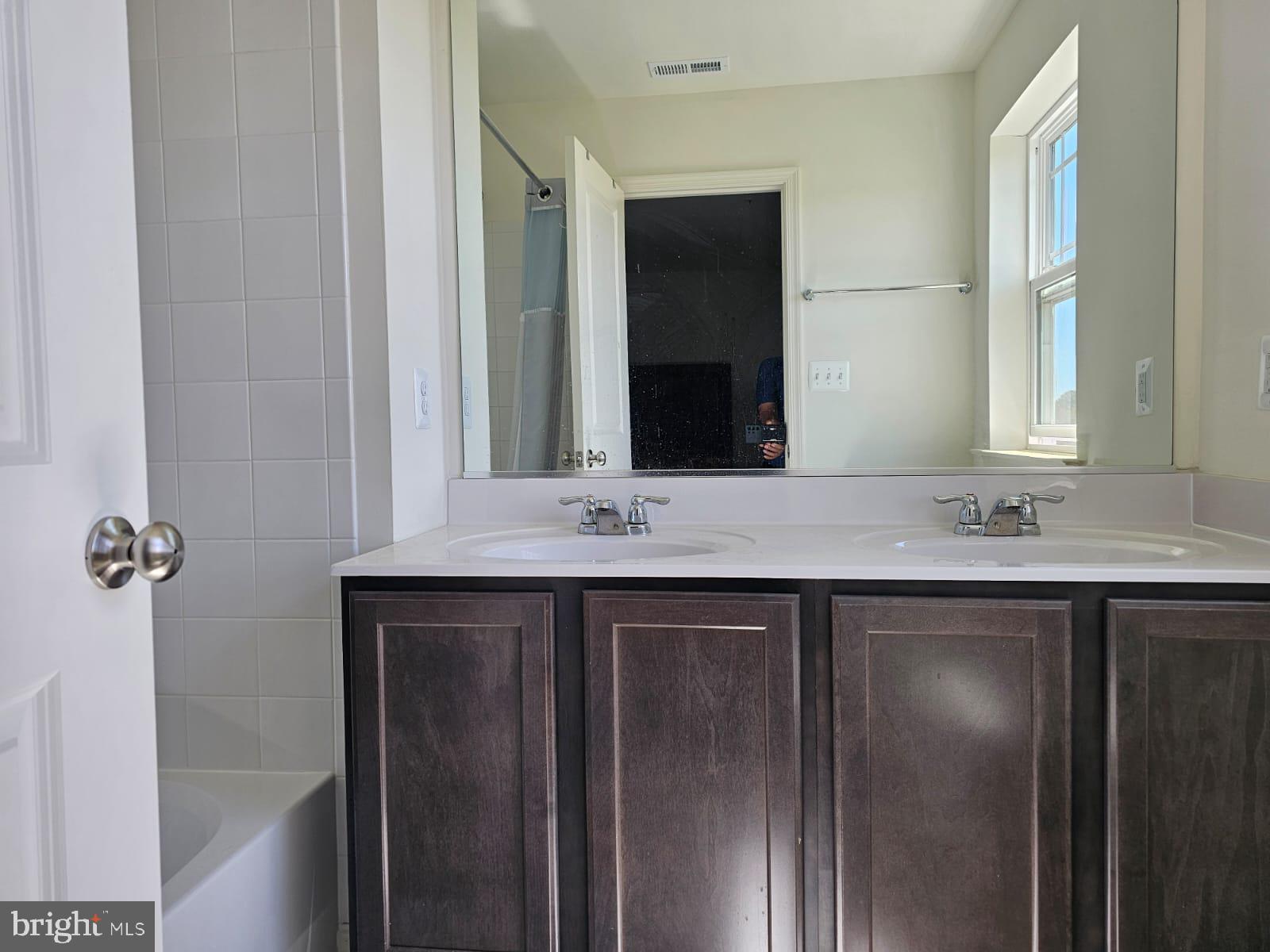 2506 Boeing Way Cambridge, MD 21613 - Photo 12 of 19 a bathroom with a sink and a mirror