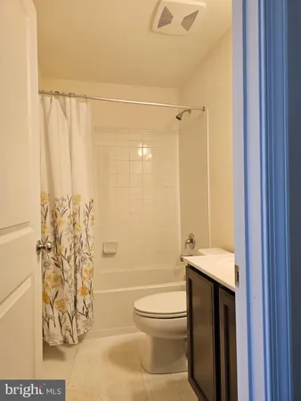 a bathroom with a toilet and shower