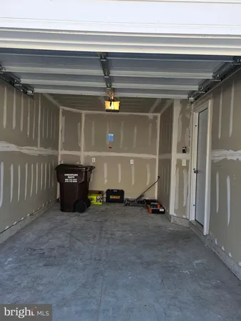 a view of an empty room with a fireplace