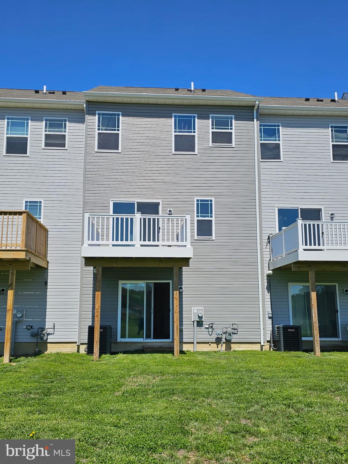 2506 Boeing Way Cambridge, MD 21613 - Photo 19 of 19 a front view of a brick building with a yard