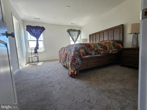 a bed room with a bed and a couch