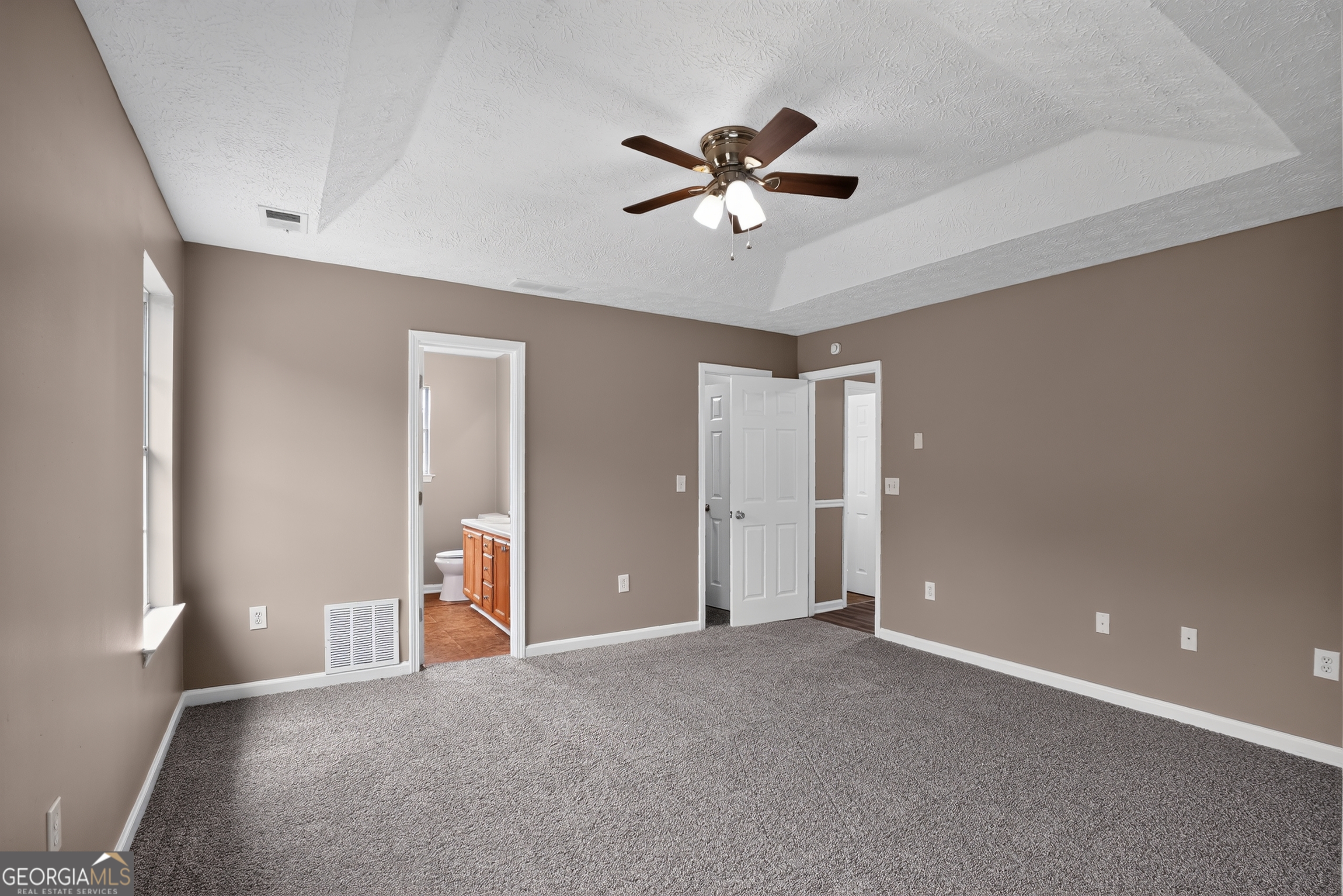 75 Linsley Way Covington, GA 30016 - Photo 33 of 48 a view of a livingroom with a ceiling fan