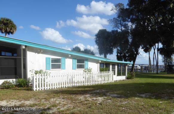 126 Pique Road Crescent City, FL 32112 - Photo 1 of 20 front view of a house with a garden