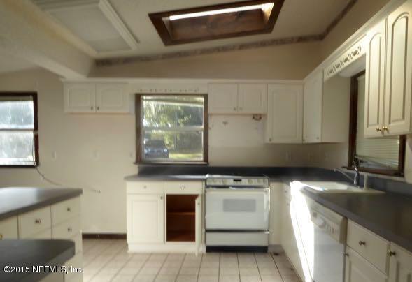 126 Pique Road Crescent City, FL 32112 - Photo 19 of 20 a kitchen with a sink and a stove