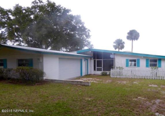 126 Pique Road Crescent City, FL 32112 - Photo 2 of 20 a front view of house with yard and trees in the background