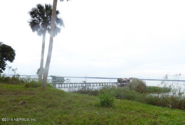 126 Pique Road Crescent City, FL 32112 - Photo 5 of 20 a view of a lake with a big yard