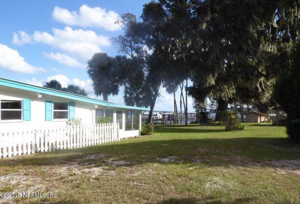 126 Pique Road Crescent City, FL 32112 - Photo 9 of 20 a view of a house with a yard