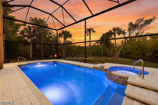 a view of backyard with swimming pool