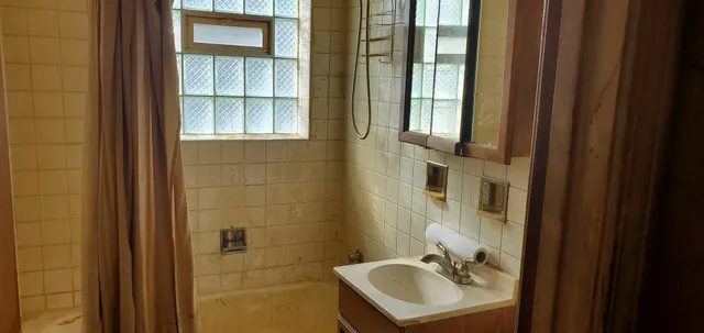 a bathroom with a sink and a mirror