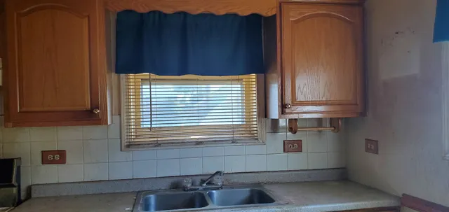 a bathroom with a sink and a window