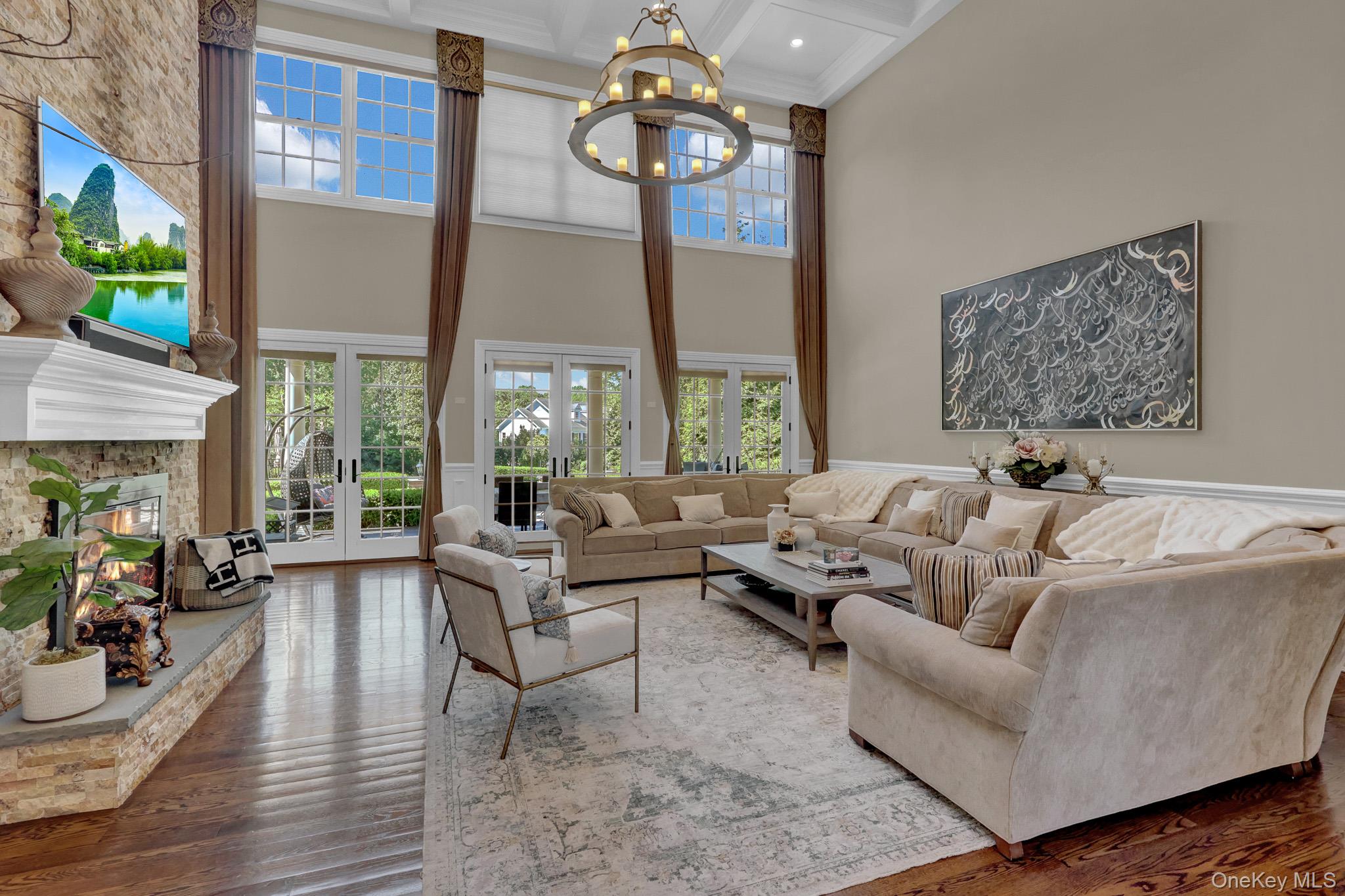 36 Old Field Road Setauket, NY 11733 - Photo 15 of 42 a living room with furniture chandelier and a large window