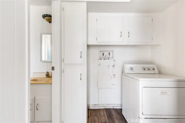 a view of storage and utility room with washer and dryer