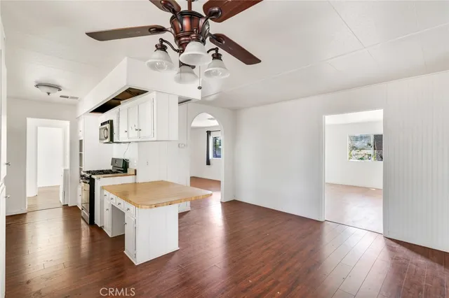 a view of a kitchen counter space and wooden floor