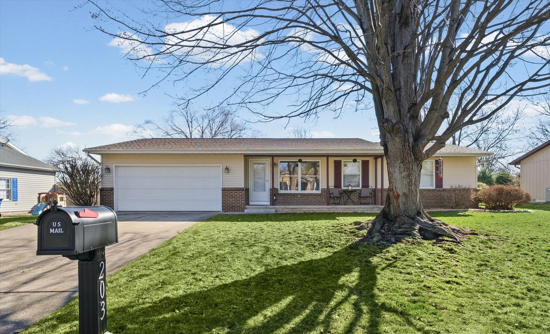 203 Valley Road Monticello, IL 61856 - Photo 1 of 25 a front view of a house with garden