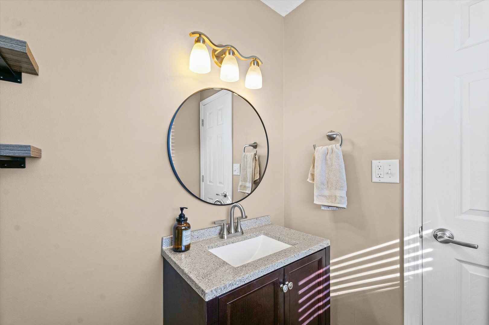 203 Valley Road Monticello, IL 61856 - Photo 15 of 25 a bathroom with a sink and a mirror