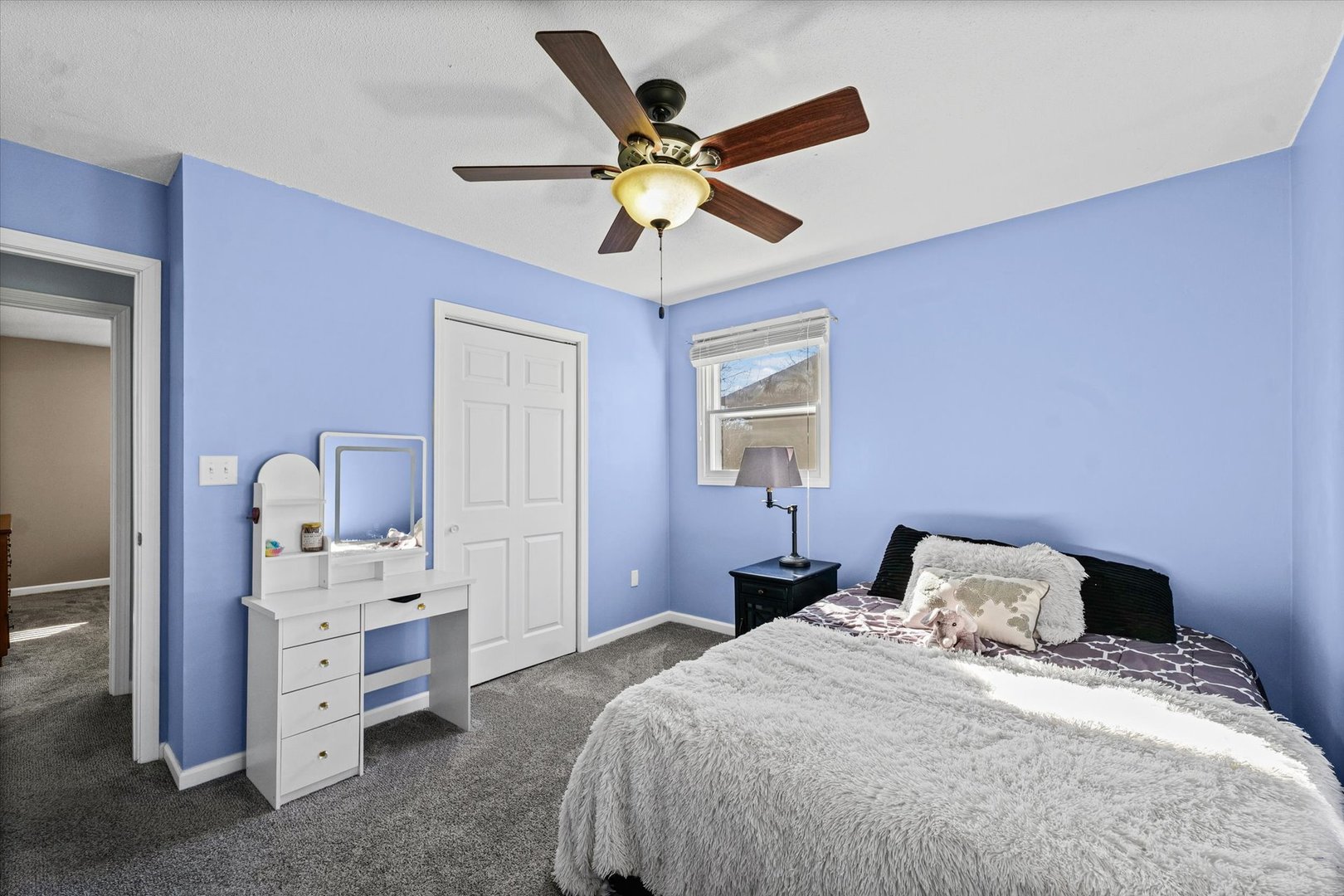 203 Valley Road Monticello, IL 61856 - Photo 17 of 25 a bedroom with a bed and ceiling fan
