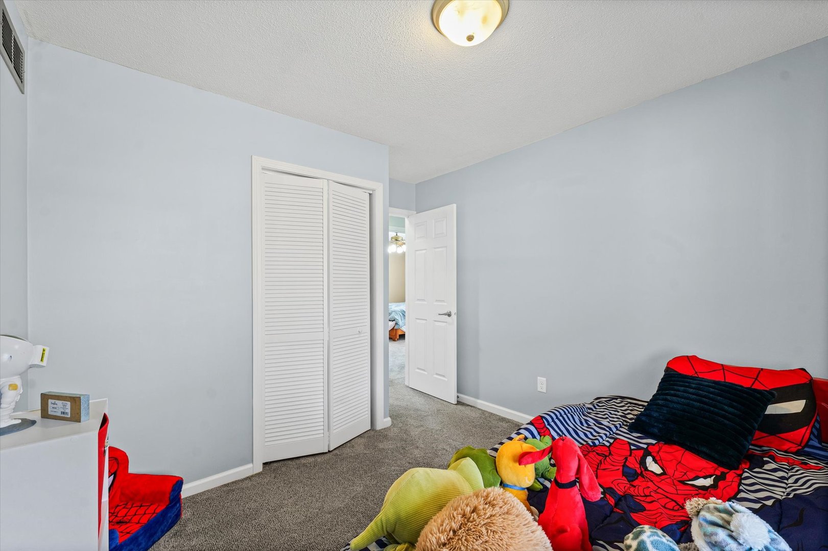 203 Valley Road Monticello, IL 61856 - Photo 20 of 25 a bedroom with a bed and a dresser