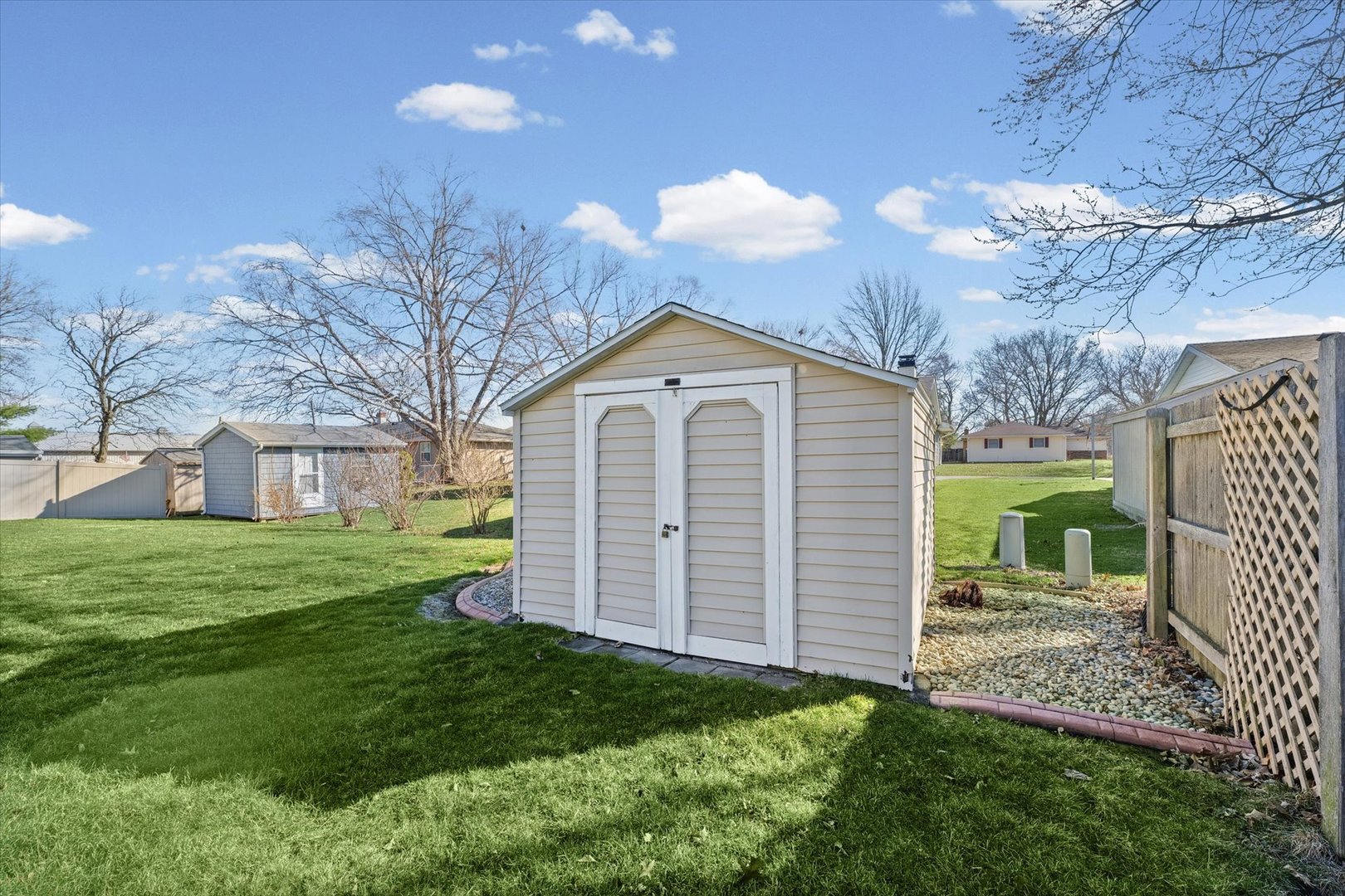 203 Valley Road Monticello, IL 61856 - Photo 22 of 25 a front view of a house with a garden