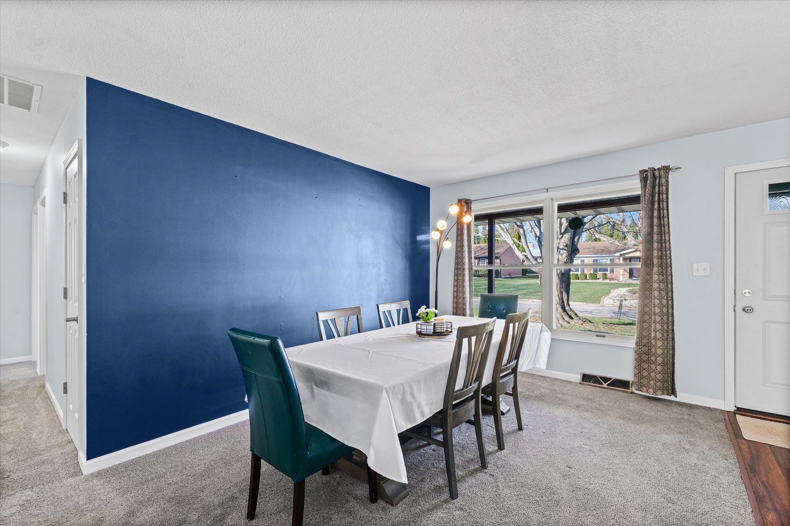 203 Valley Road Monticello, IL 61856 - Photo 4 of 25 a view of a dining room with furniture window and outside view