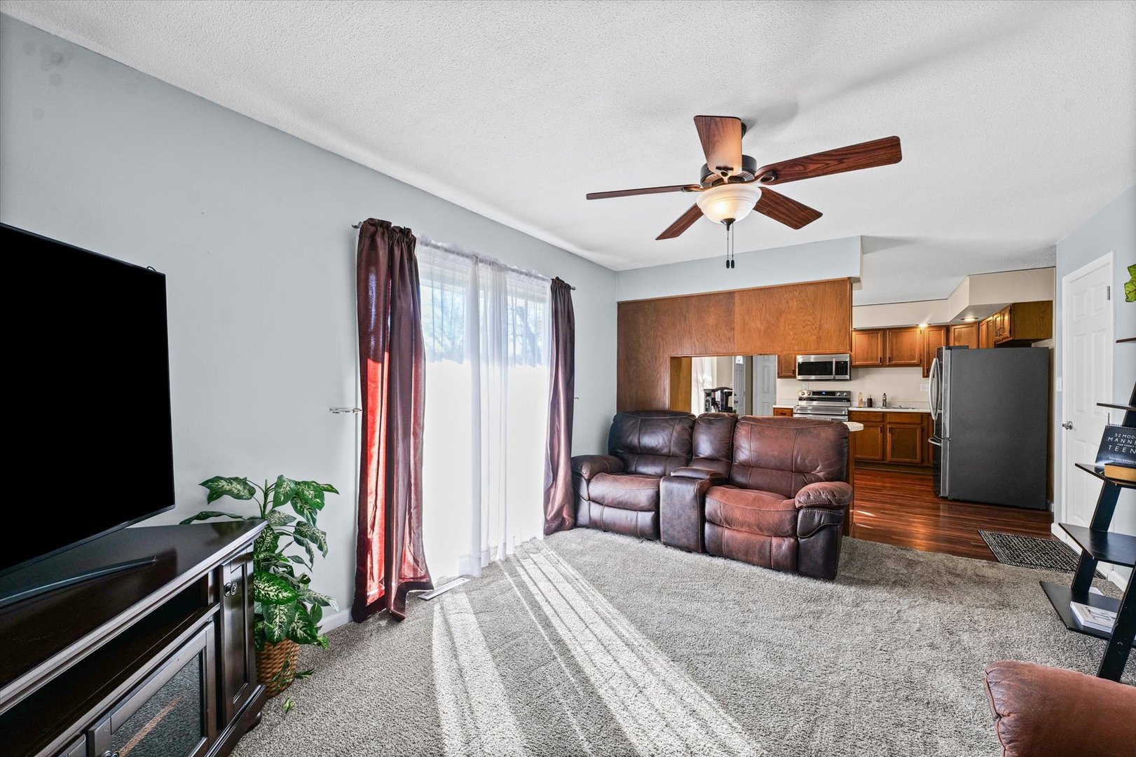 203 Valley Road Monticello, IL 61856 - Photo 7 of 25 a bedroom with furniture and a flat screen tv