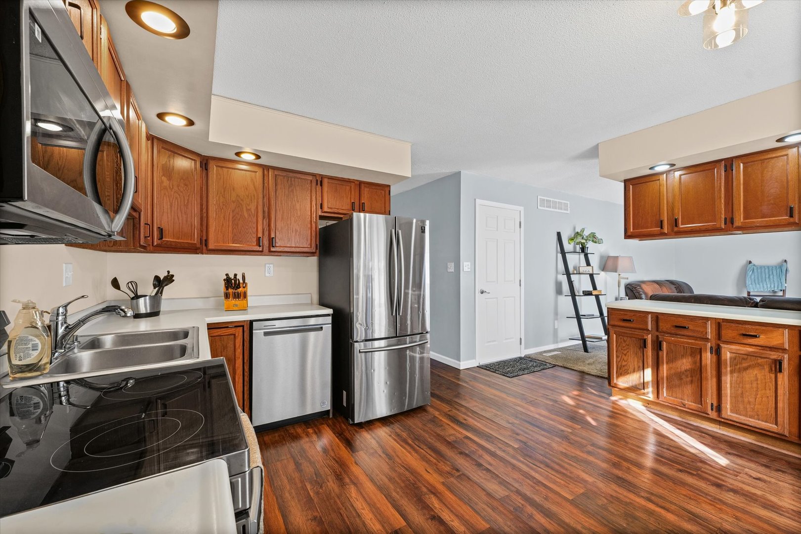 203 Valley Road Monticello, IL 61856 - Photo 10 of 25 a kitchen with stainless steel appliances granite countertop a refrigerator stove top oven and sink