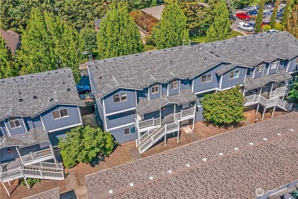 an aerial view of a house with a yard and plants