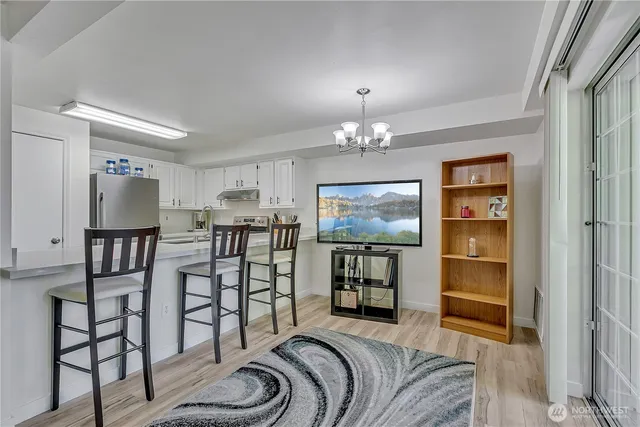 a bedroom with furniture and a chandelier