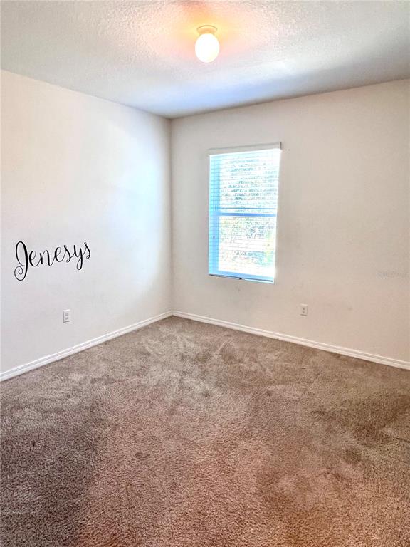 321 Blue Point Drive Ruskin, FL 33570 - Photo 13 of 18 an empty room with a window