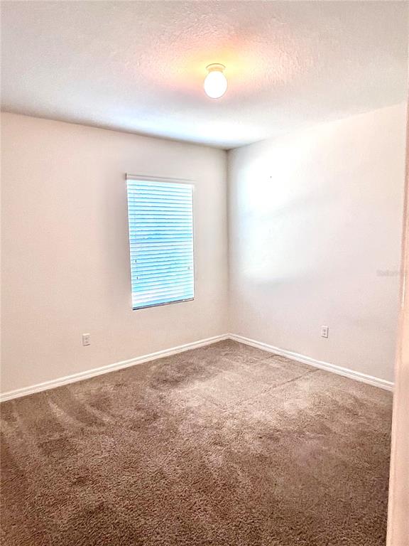 321 Blue Point Drive Ruskin, FL 33570 - Photo 15 of 18 an empty room with a window