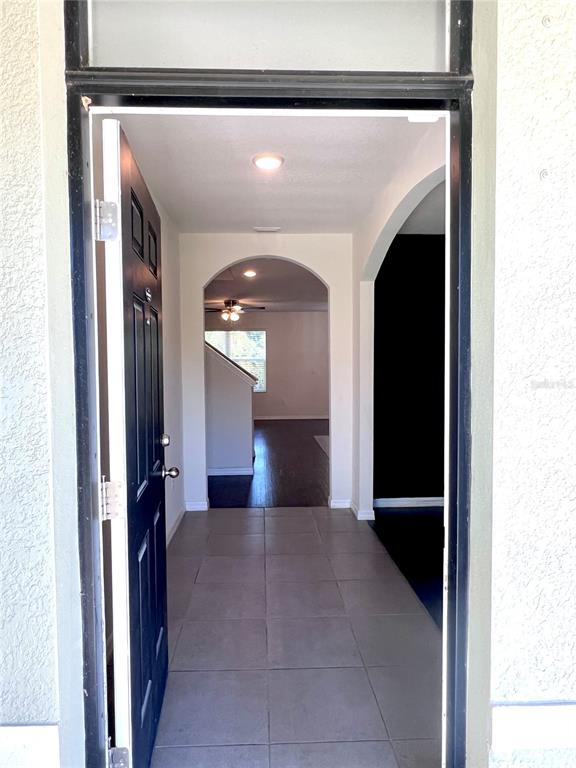 321 Blue Point Drive Ruskin, FL 33570 - Photo 2 of 18 a view of a hallway with wooden floor