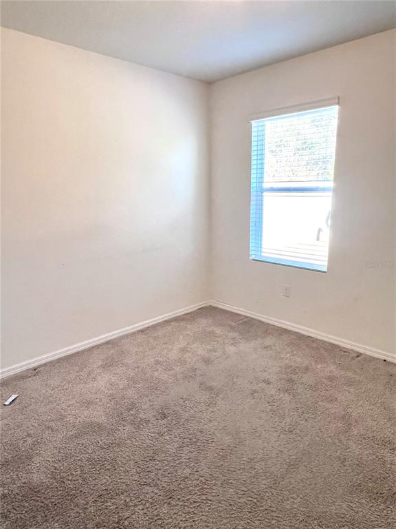 321 Blue Point Drive Ruskin, FL 33570 - Photo 7 of 18 an empty room with a window