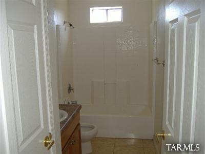 155 Paseo Dulzura Rio Rico, AZ 85648 - Photo 2 of 20 a bathroom with a bathtub and shower