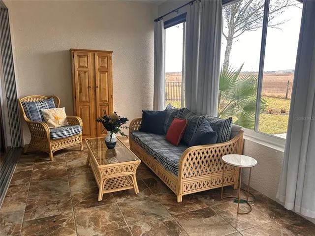 a living room with furniture and a window
