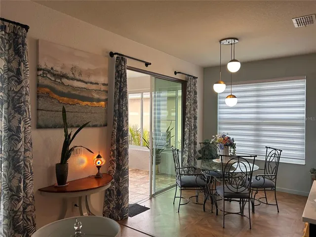 a view of a livingroom with furniture and a window