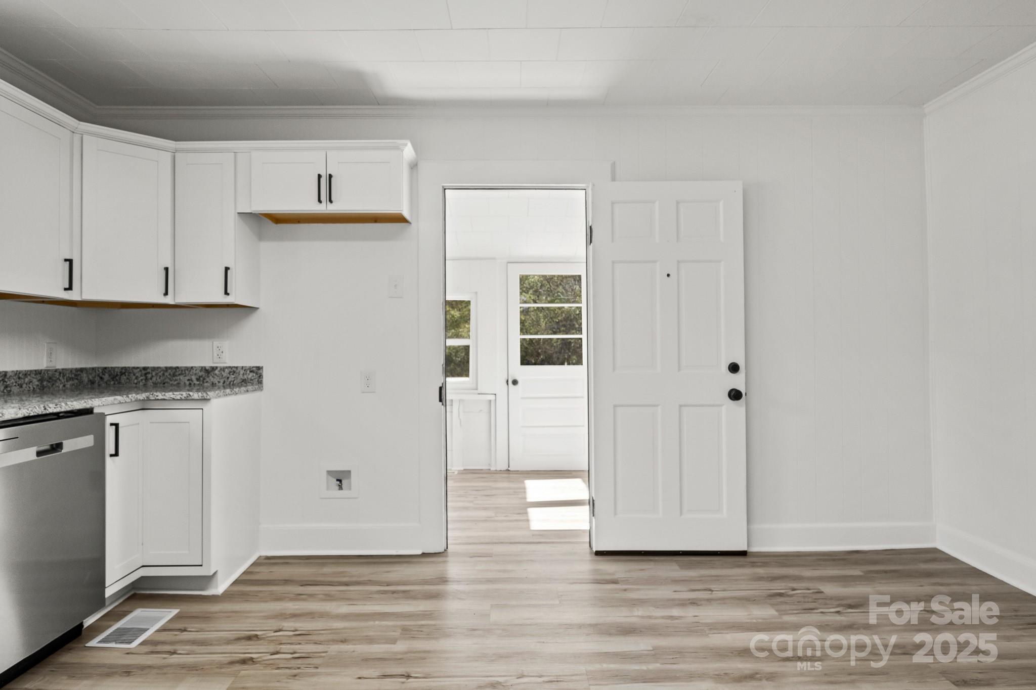 418 Charlotte Street York, SC 29745 - Photo 13 of 37 a view of a kitchen with wooden floor