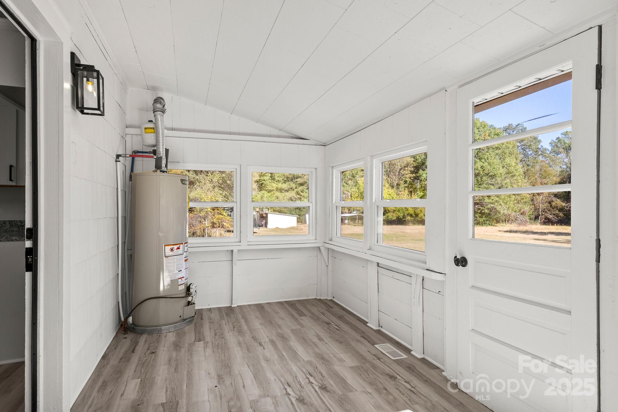 418 Charlotte Street York, SC 29745 - Photo 15 of 37 a big room with wooden floor and windows