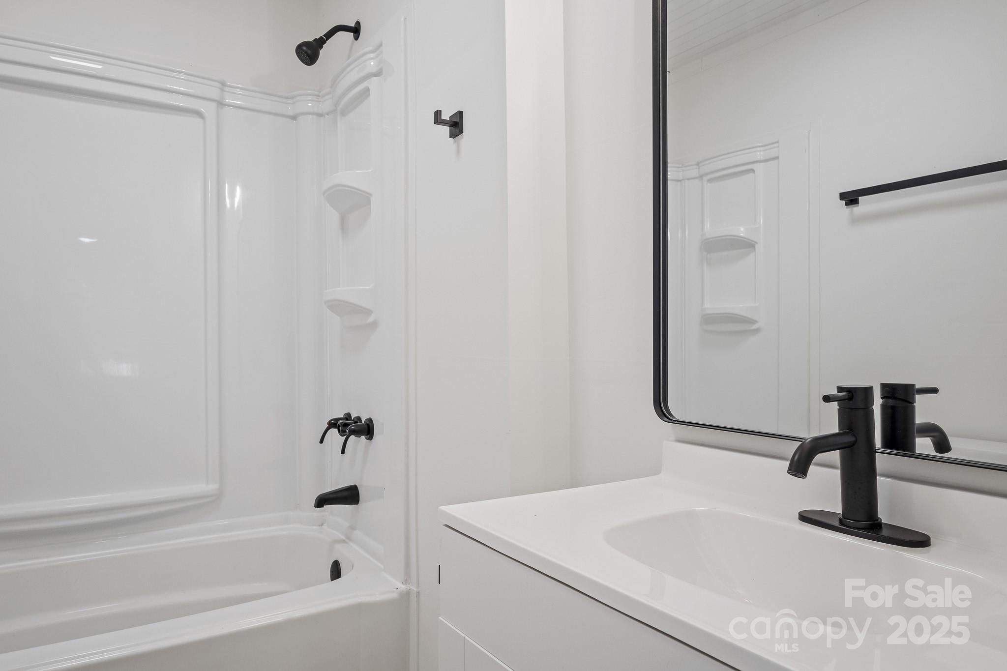 418 Charlotte Street York, SC 29745 - Photo 18 of 37 a bathroom with a sink and a bathtub