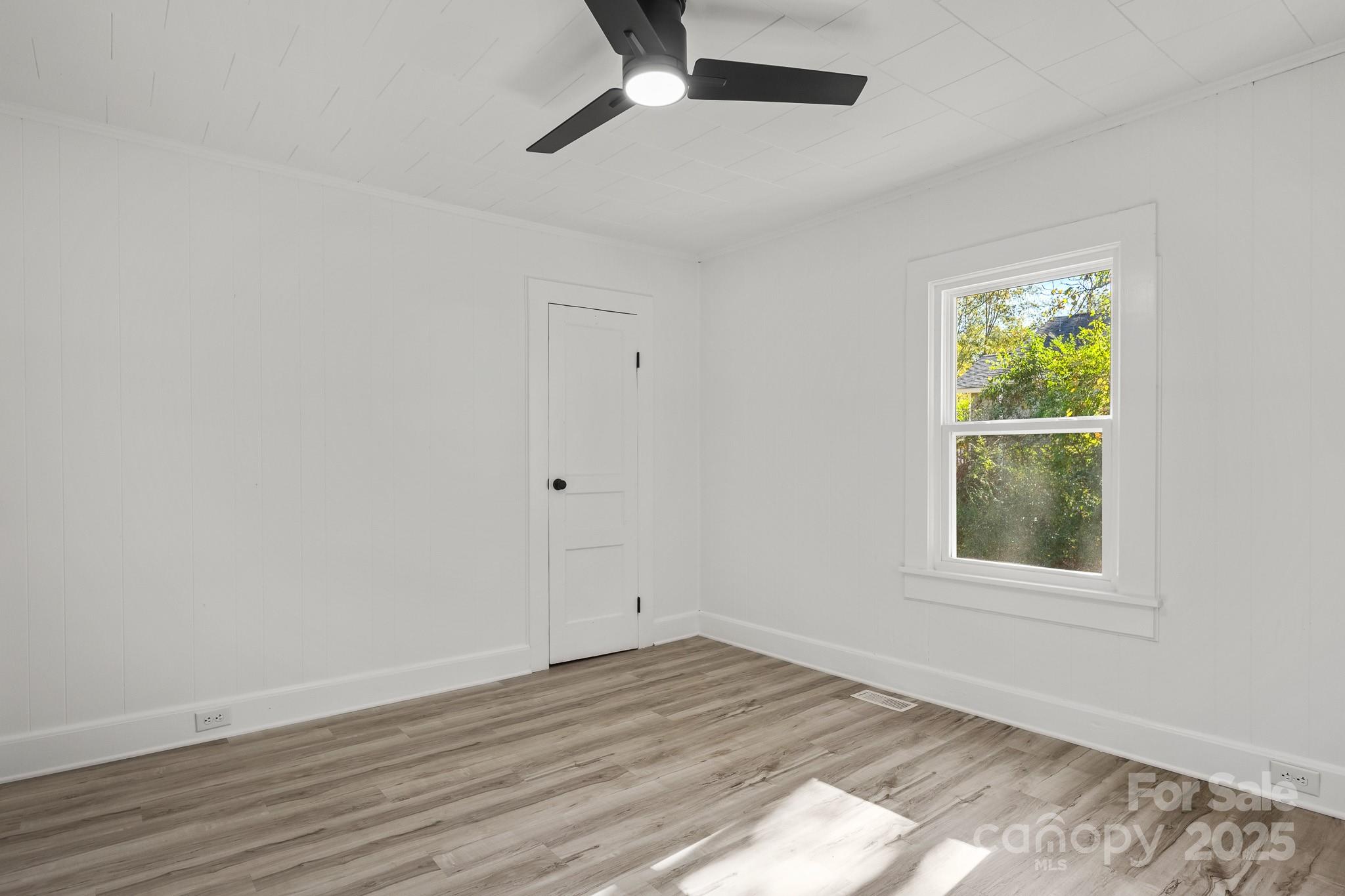 418 Charlotte Street York, SC 29745 - Photo 20 of 37 wooden floor in an empty room with a window