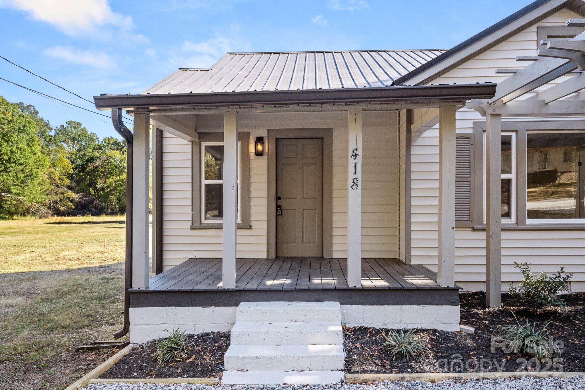 418 Charlotte Street York, SC 29745 - Photo 2 of 37 a front view of a house with a yard