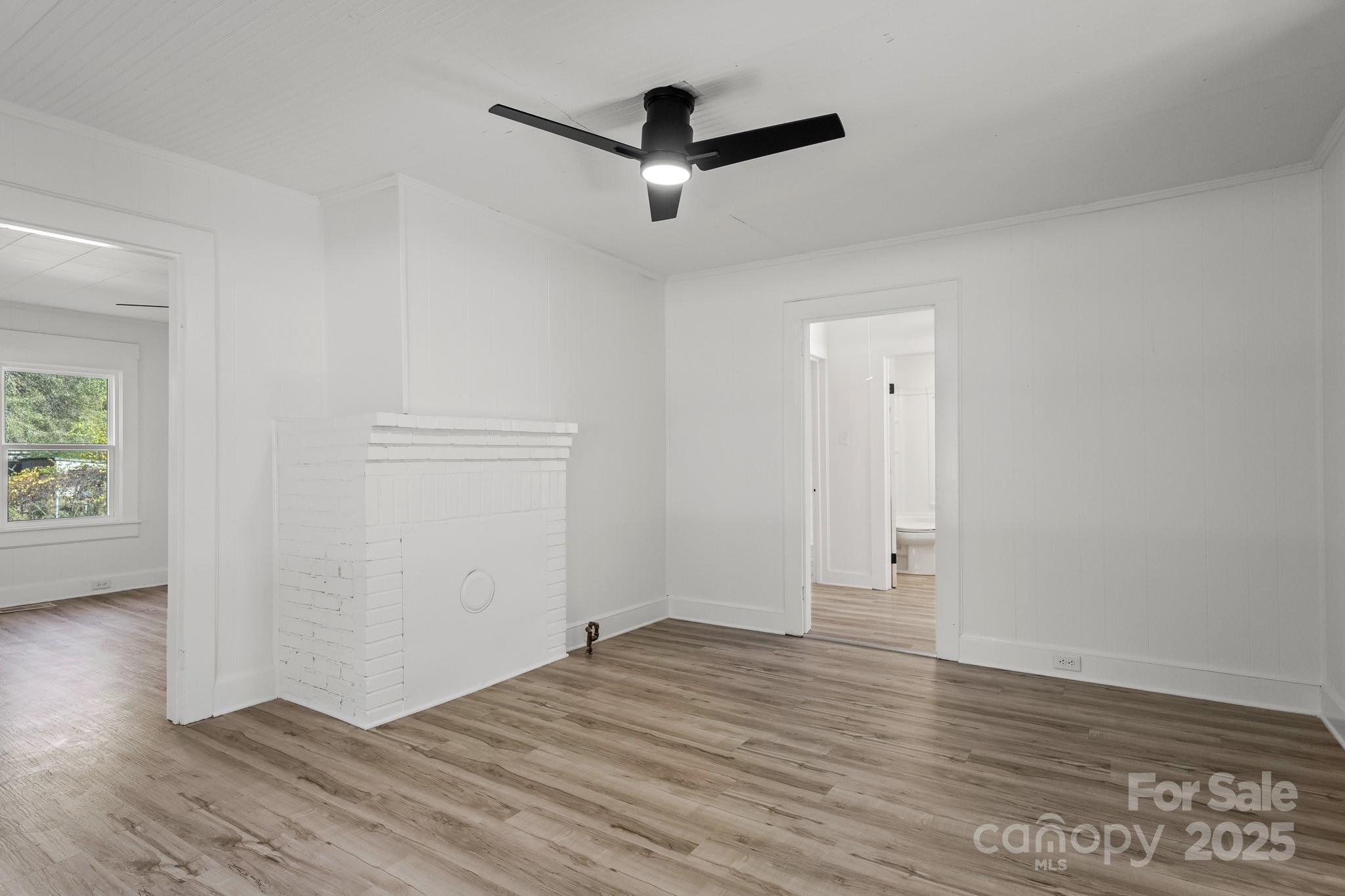 418 Charlotte Street York, SC 29745 - Photo 23 of 37 a view of empty room with wooden floor and fan