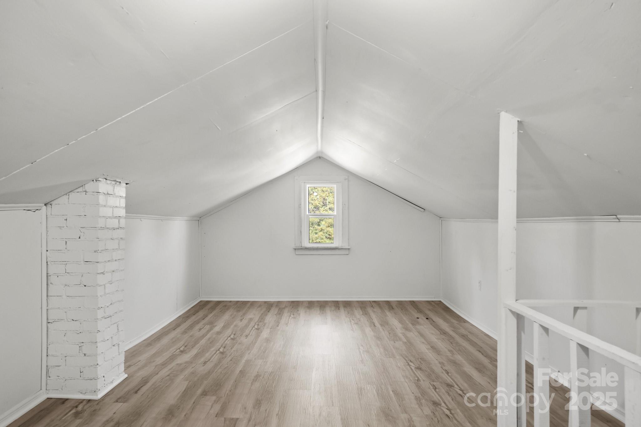 418 Charlotte Street York, SC 29745 - Photo 30 of 37 a view of an empty room with wooden floor and a window