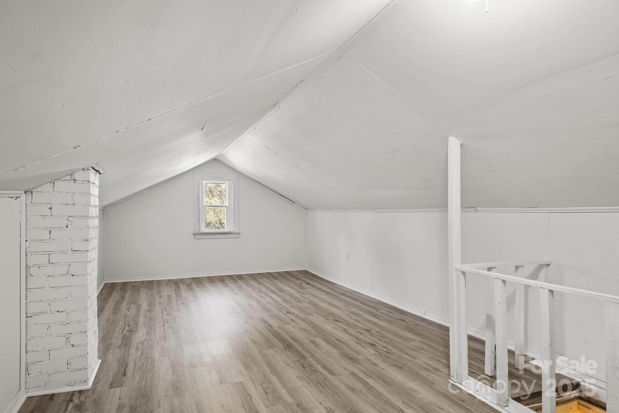 418 Charlotte Street York, SC 29745 - Photo 31 of 37 an empty room with wooden floor and windows