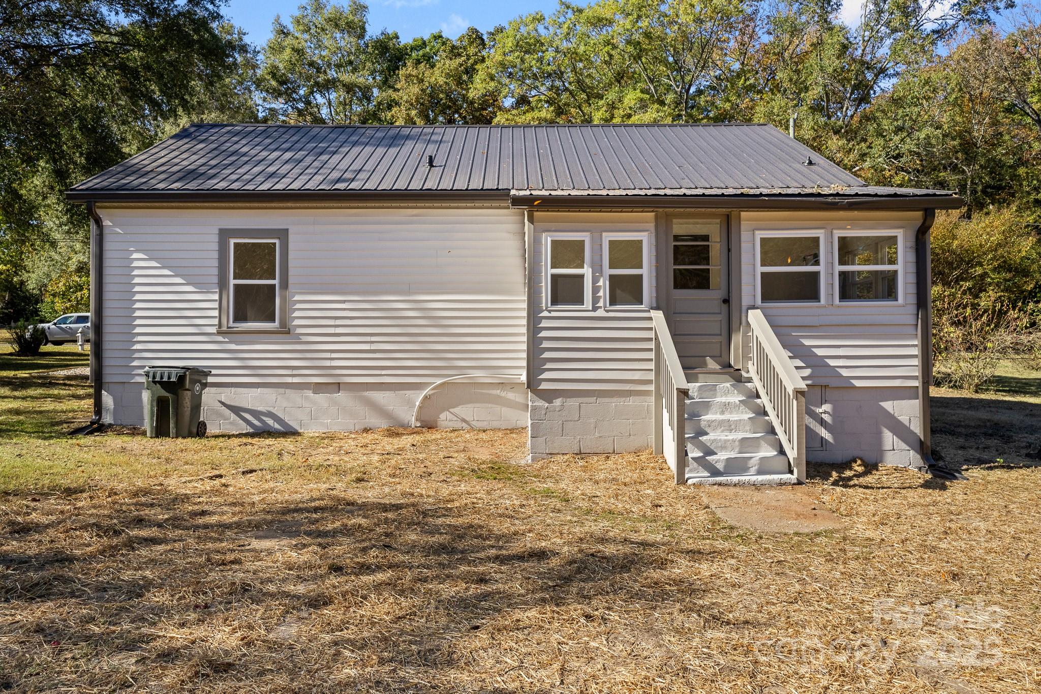 418 Charlotte Street York, SC 29745 - Photo 32 of 37 a view of a house with a yard