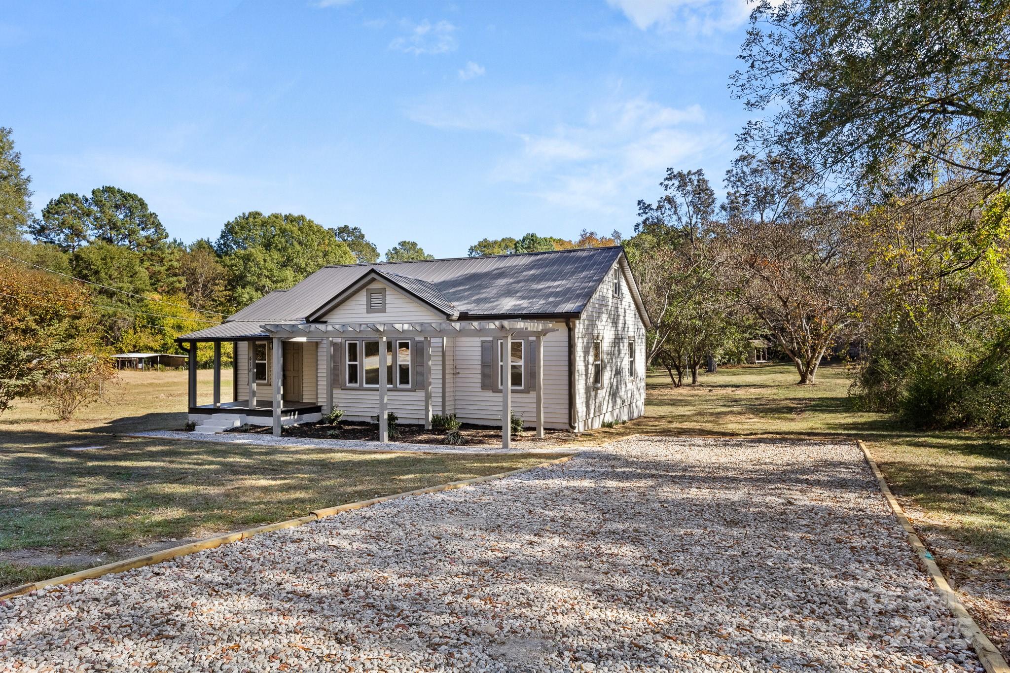 418 Charlotte Street York, SC 29745 - Photo 37 of 37 a front view of a house with a yard