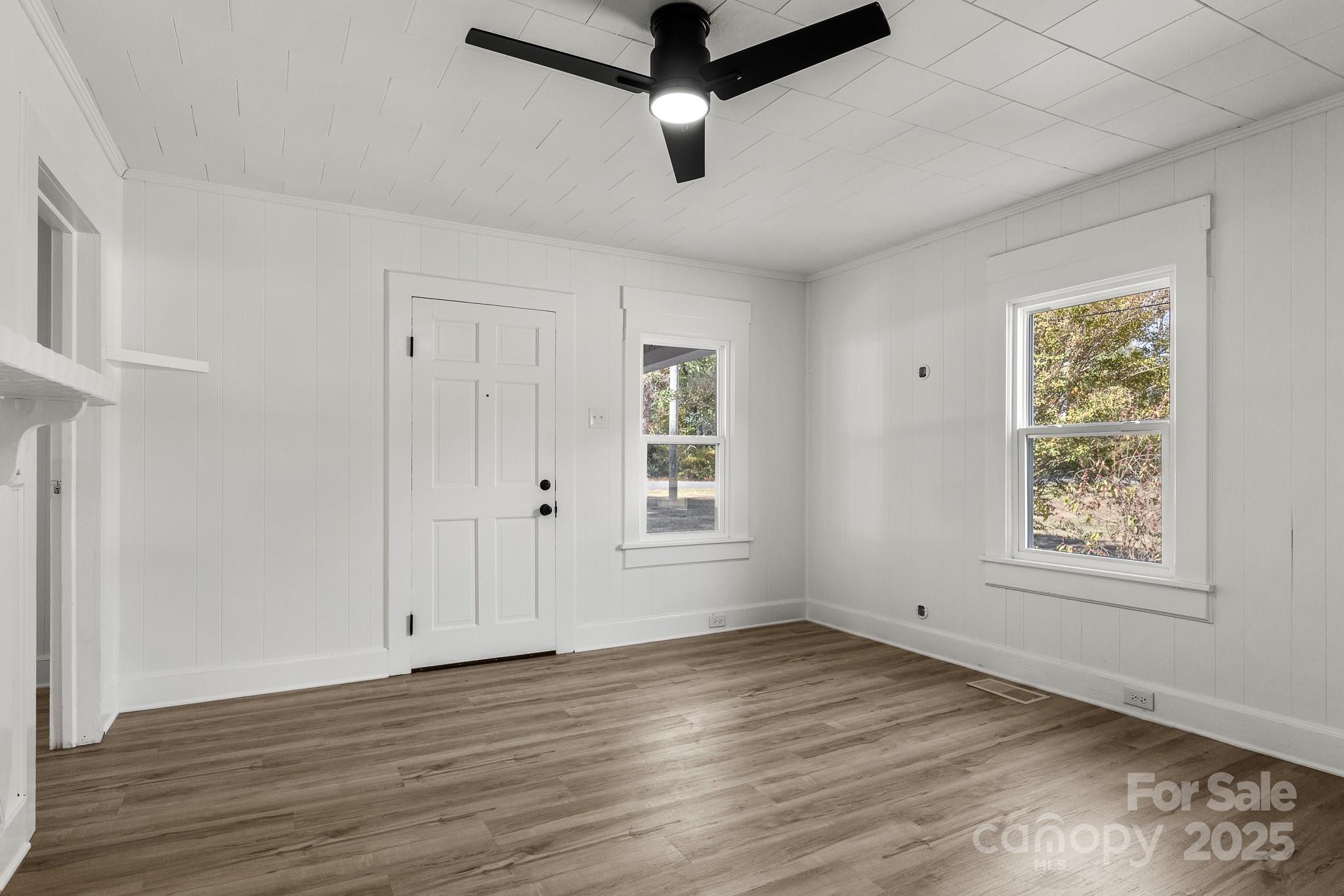 418 Charlotte Street York, SC 29745 - Photo 8 of 37 wooden floor in an empty room with a window