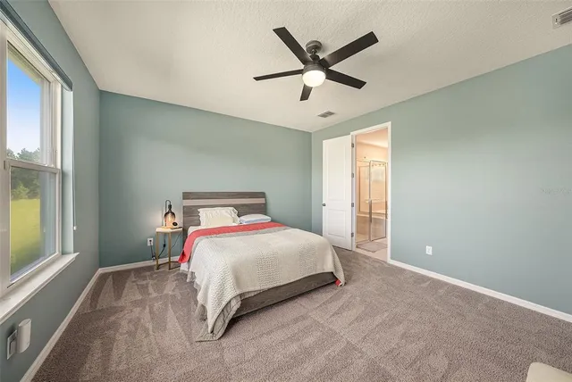 a bathroom with a tub sink shower and mirror