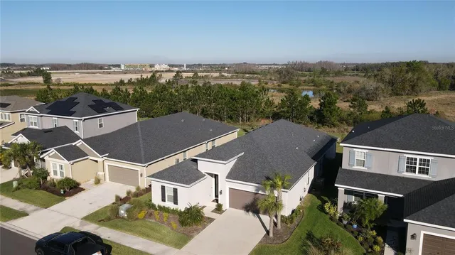 an aerial view of a house with a garden