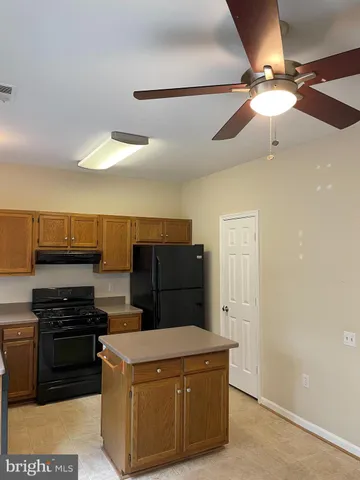 a kitchen with a cabinets and appliances