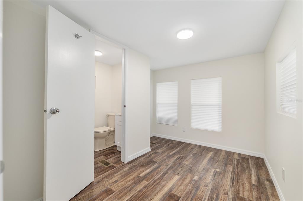 905 South Sunfish Avenue Inverness, FL 34450 - Photo 22 of 39 a view of empty room with wooden floor and window